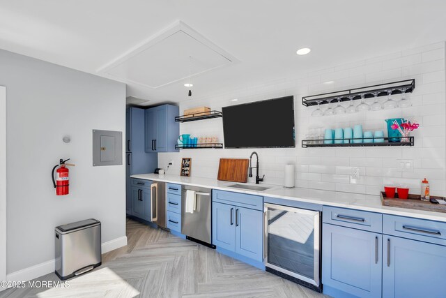 401 Overlook Dr, Neptune Township, NJ 07753 - kitchen with open shelves, beverage cooler, blue cabinetry, a sink, and stainless steel dishwasher