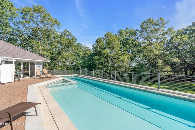 401 Overlook Dr, Neptune Township, NJ 07753 - view of swimming pool featuring fence, view of wooded area, a pool with connected hot tub, and a patio