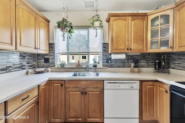 467A Chelsea Ct, Manchester, NJ 08759 - kitchen featuring dishwasher, a sink, tasteful backsplash, and glass insert cabinets