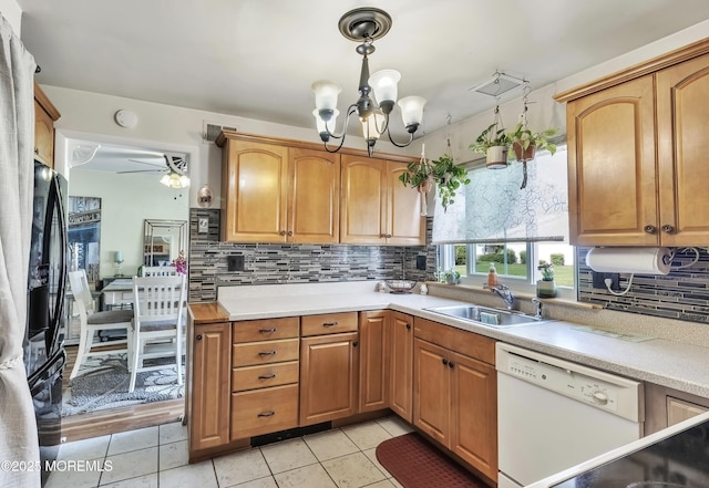467A Chelsea Ct, Manchester, NJ 08759 - kitchen with dishwasher, a sink, a chandelier, backsplash, and light countertops