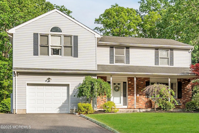 6 Blanche Dr, New Egypt, NJ 08533 - view of front of house with a garage, brick siding, a front yard, a porch, and driveway