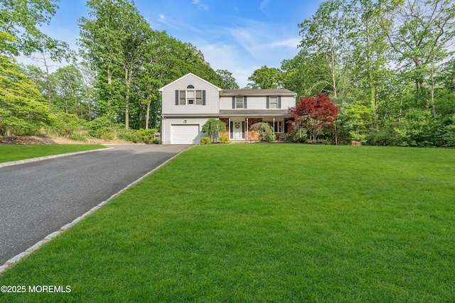 6 Blanche Dr, New Egypt, NJ 08533 - view of front facade featuring an attached garage, driveway, covered porch, and a front yard