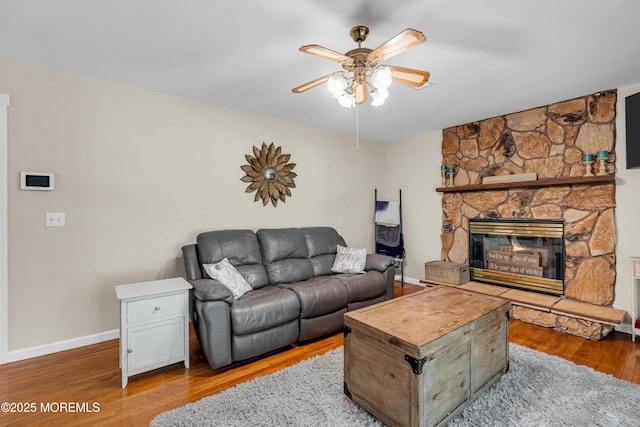 6 Blanche Dr, New Egypt, NJ 08533 - living area with a ceiling fan, wood finished floors, baseboards, and a stone fireplace