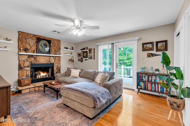 6 Blanche Dr, New Egypt, NJ 08533 - living room featuring a ceiling fan, light wood-style flooring, and a stone fireplace
