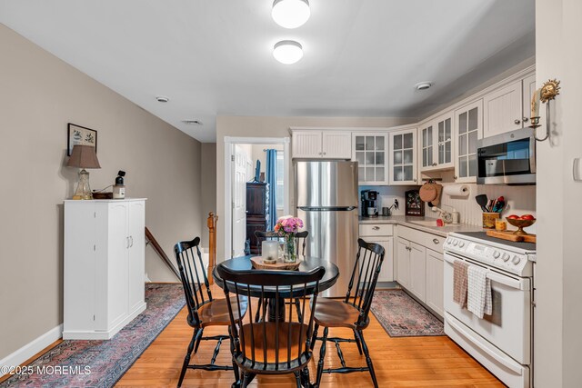 6 Blanche Dr, New Egypt, NJ 08533 - kitchen with stainless steel appliances, light wood-style flooring, and white cabinetry