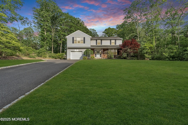 6 Blanche Dr, New Egypt, NJ 08533 - traditional-style house featuring an attached garage, driveway, a lawn, and covered porch