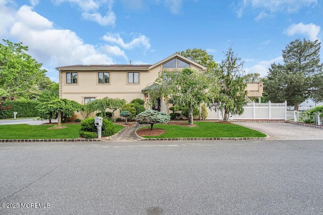 251 Genes Dr, Toms River, NJ 08753 - view of front facade featuring stucco siding and driveway