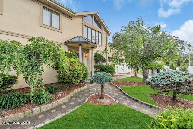 251 Genes Dr, Toms River, NJ 08753 - view of front of home with stucco siding and fence