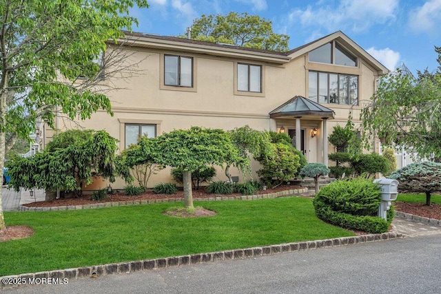 251 Genes Dr, Toms River, NJ 08753 - view of front of house featuring stucco siding and a front lawn