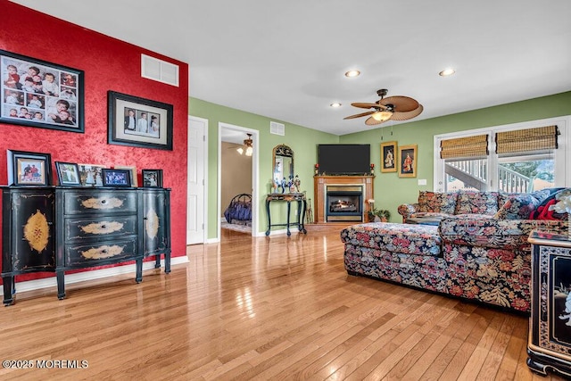 251 Genes Dr, Toms River, NJ 08753 - living area featuring ceiling fan, wood-type flooring, recessed lighting, a lit fireplace, and baseboards