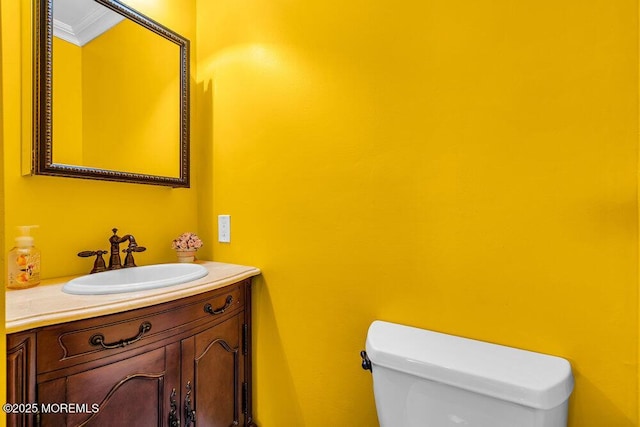 251 Genes Dr, Toms River, NJ 08753 - bathroom with toilet, vanity, and ornamental molding
