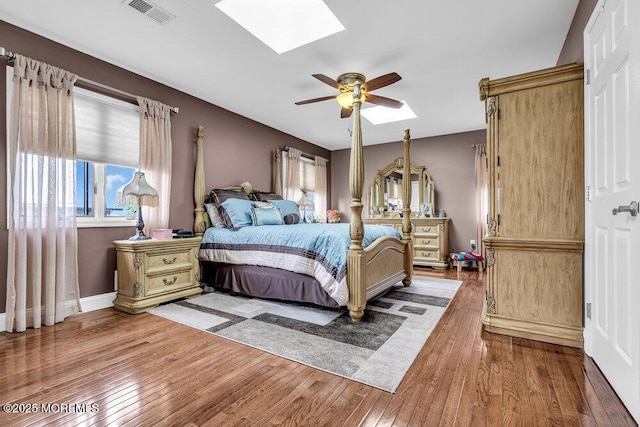 251 Genes Dr, Toms River, NJ 08753 - bedroom featuring a skylight, hardwood / wood-style flooring, and a ceiling fan