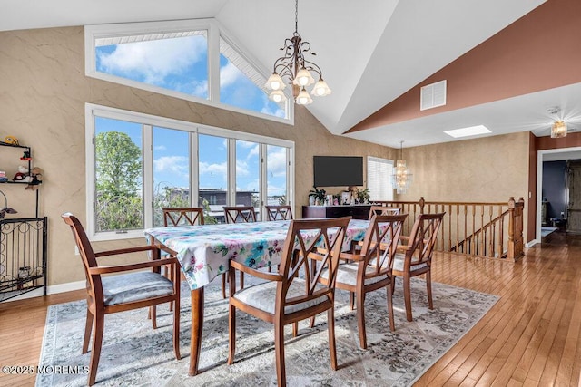 251 Genes Dr, Toms River, NJ 08753 - dining space with a chandelier, high vaulted ceiling, hardwood / wood-style flooring, and a textured wall