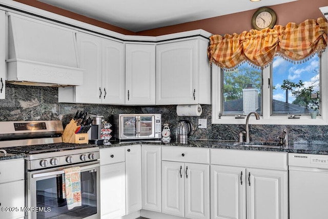 251 Genes Dr, Toms River, NJ 08753 - kitchen featuring stainless steel range with gas stovetop, white dishwasher, a sink, and white cabinetry