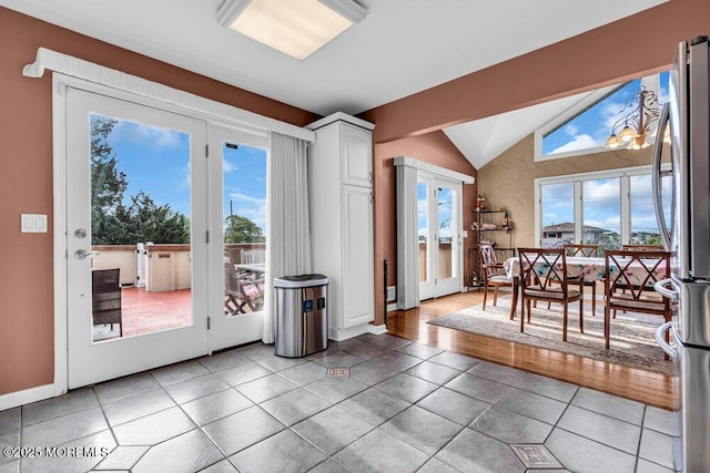 251 Genes Dr, Toms River, NJ 08753 - doorway with lofted ceiling, tile patterned flooring, healthy amount of natural light, and baseboards
