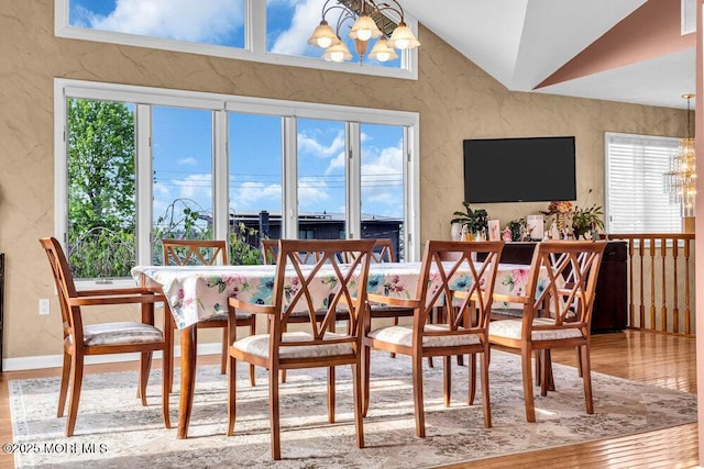 251 Genes Dr, Toms River, NJ 08753 - dining space featuring a chandelier, wood finished floors, a textured wall, and lofted ceiling