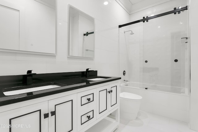 full bathroom featuring double vanity, combined bath / shower with glass door, toilet, and ornamental molding