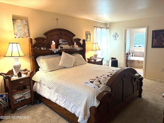 carpeted bedroom featuring ensuite bath