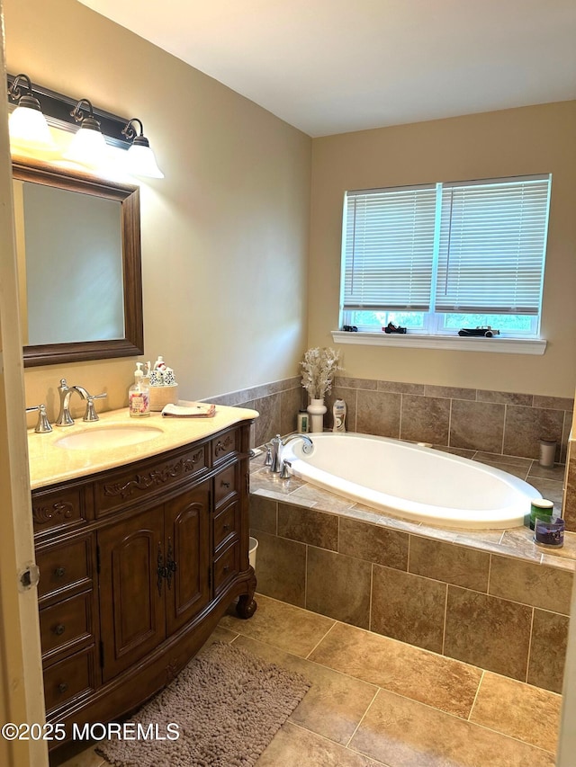 full bathroom with vanity and a garden tub