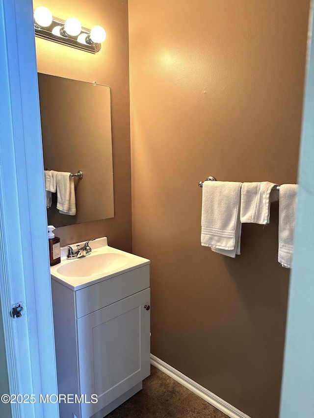 bathroom with vanity and baseboards