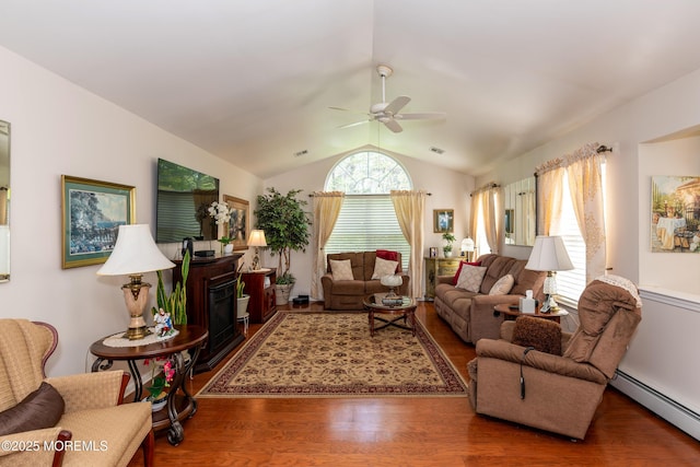 102 Clear Lake Rd, Whiting, NJ 08759 - living area with a baseboard heating unit, wood finished floors, plenty of natural light, ceiling fan, and vaulted ceiling