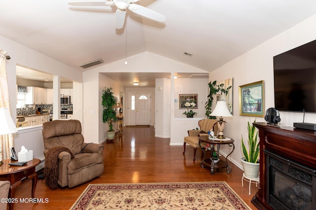 102 Clear Lake Rd, Whiting, NJ 08759 - living area featuring lofted ceiling, ceiling fan, wood finished floors, baseboards, and a glass covered fireplace