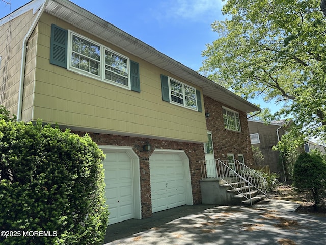 697 Vaughn Ave, Toms River, NJ 08753 - view of front of home featuring an attached garage and brick siding