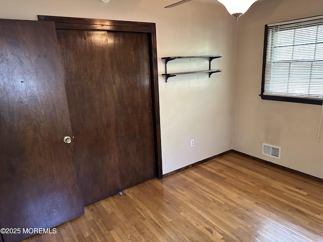 697 Vaughn Ave, Toms River, NJ 08753 - unfurnished bedroom with hardwood / wood-style floors, a closet, and baseboards