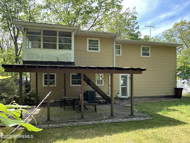 697 Vaughn Ave, Toms River, NJ 08753 - rear view of house with cooling unit, a patio, and a yard