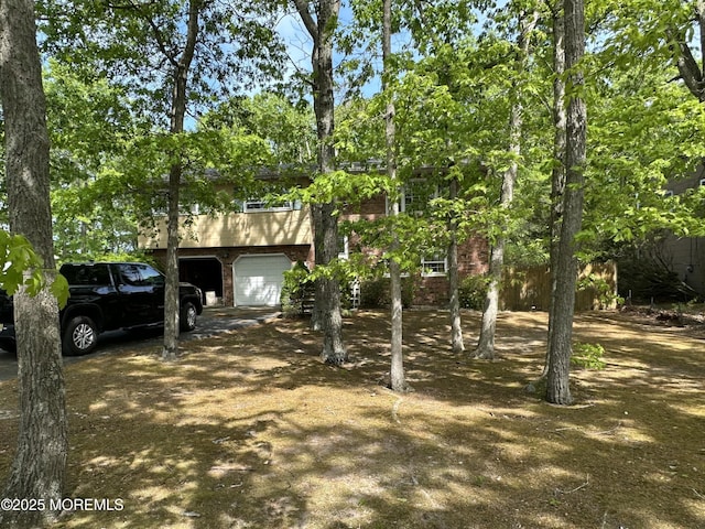 697 Vaughn Ave, Toms River, NJ 08753 - view of front of property featuring brick siding and a garage