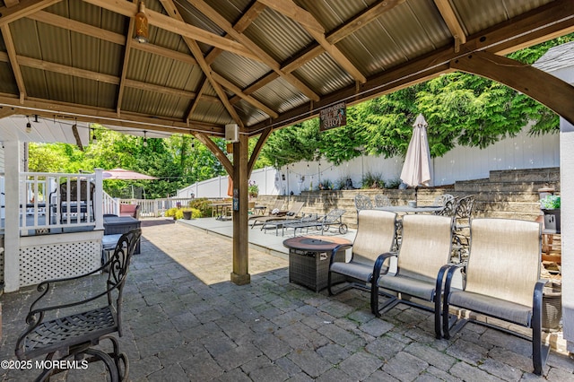 view of patio with fence and a gazebo