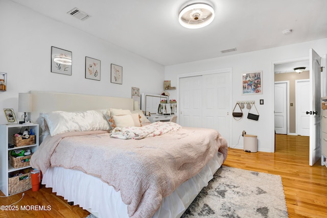 bedroom featuring a closet and wood finished floors