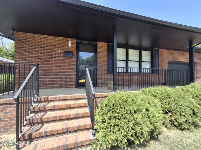 22 Macedulski Ter, South Amboy, NJ 08879 - doorway to property with brick siding