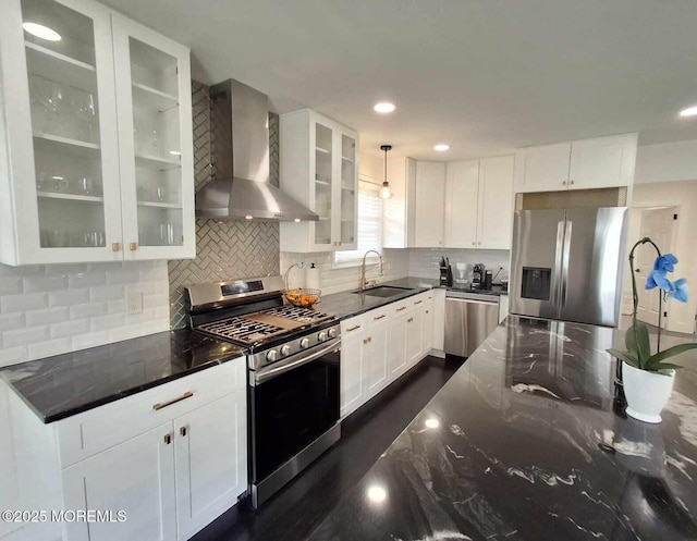 22 Macedulski Ter, South Amboy, NJ 08879 - kitchen with stainless steel appliances, wall chimney range hood, dark stone countertops, white cabinetry, and tasteful backsplash