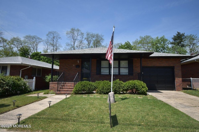 22 Macedulski Ter, South Amboy, NJ 08879 - ranch-style house featuring a garage, brick siding, and driveway