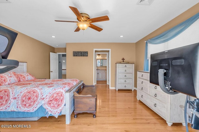 bedroom featuring light wood-style flooring, recessed lighting, ceiling fan, and ensuite bathroom