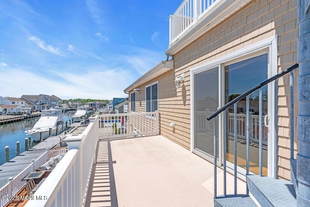 balcony featuring a water view
