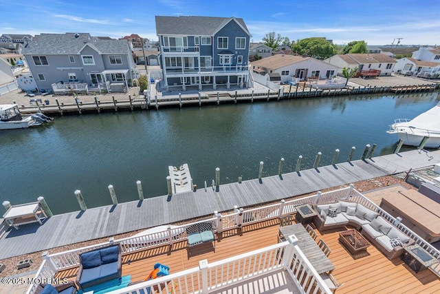 dock with a residential view and a deck with water view