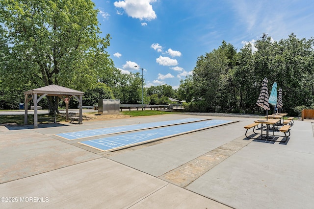 23 Marathon St, Toms River, NJ 08757 - surrounding community with shuffleboard, view of wooded area, and a gazebo