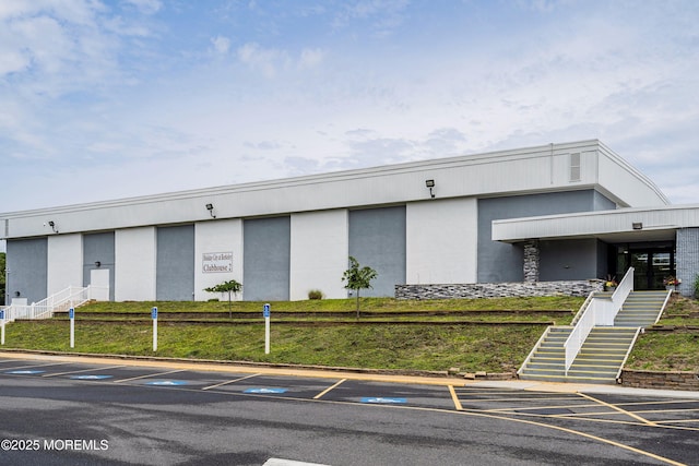 23 Marathon St, Toms River, NJ 08757 - view of building exterior with stairs and uncovered parking
