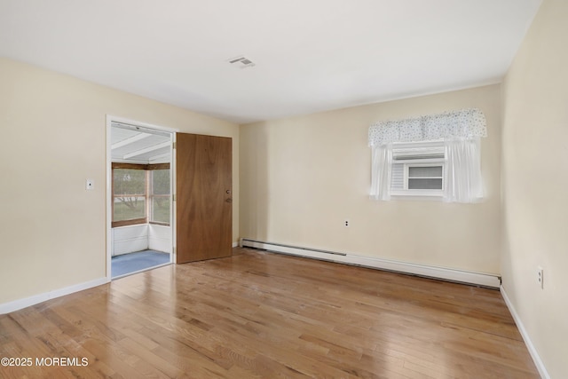 23 Marathon St, Toms River, NJ 08757 - empty room with a baseboard radiator, wood finished floors, and baseboards