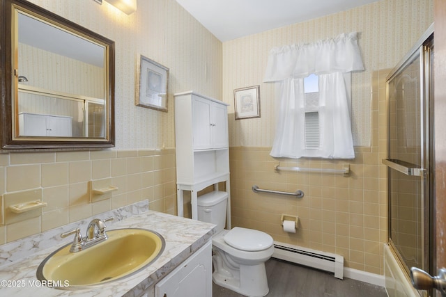 23 Marathon St, Toms River, NJ 08757 - bathroom with baseboard heating, tile walls, wallpapered walls, toilet, and wood finished floors