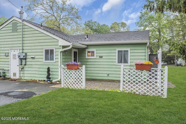 40 Mallard St Unit B, Manchester, NJ 08759 - back of house with a yard and roof with shingles
