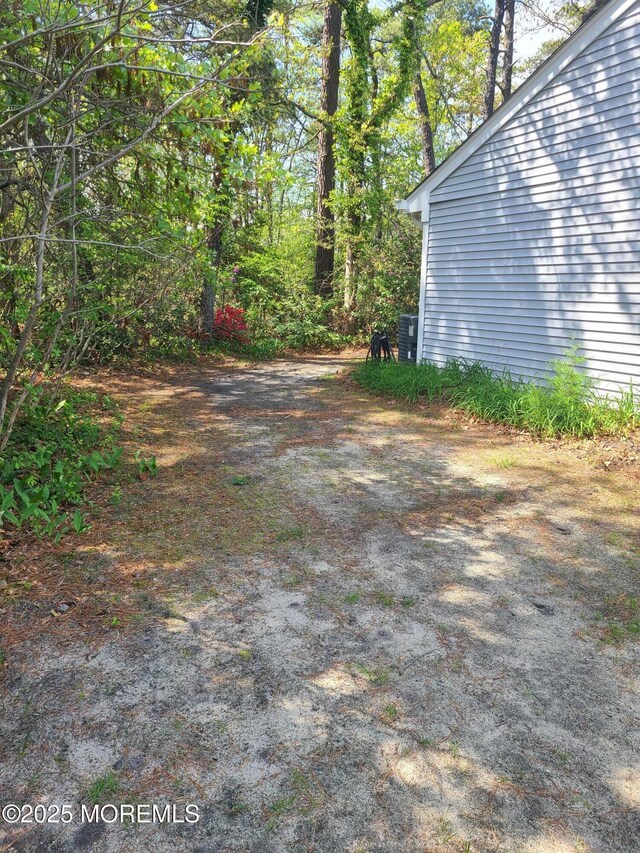 1207A Thornbury Ln Unit A, Manchester, NJ 08759 - view of yard featuring central AC unit