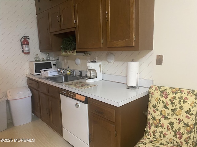 897C Inverness Ct, Lakewood, NJ 08701 - kitchen featuring white appliances, a sink, and light countertops