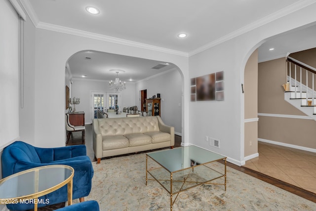 105 Shady Lane Dr, Lakewood, NJ 08701 - living area with arched walkways, a chandelier, stairs, recessed lighting, and ornamental molding