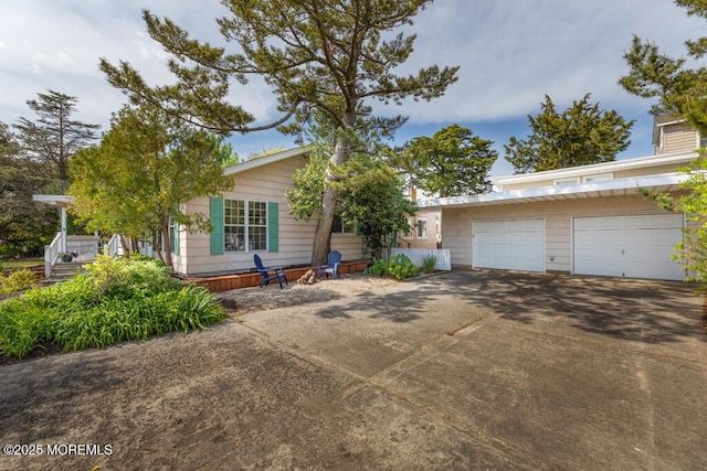 view of front of home with a garage and driveway