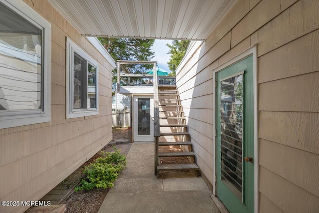 view of side of property with stairs