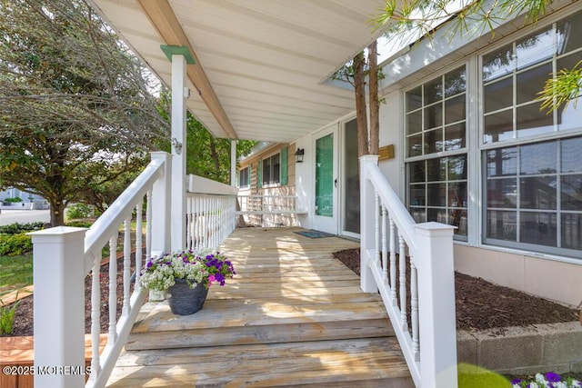 wooden deck featuring a porch