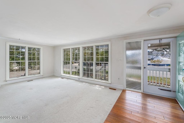 unfurnished sunroom featuring plenty of natural light